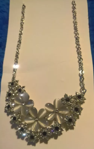Simulated White Cats Eye, Black and White Crystal Floral Necklace