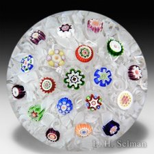 Antique Baccarat scattered millefiori on upset muslin paperweight. by Baccarat Antique