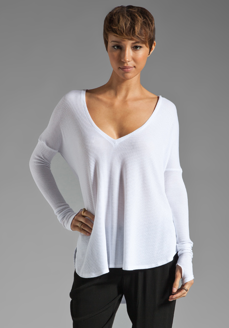 FEEL THE PIECE Robin Thermal Flowy Top with Thumb Holes in White at Revolve Clothing - Free Shipping!