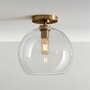 View Arren Brass Flush Mount Light with Large Round Clear Glass Shade - image 1 of 4