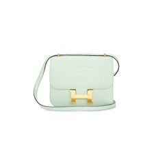 Female Model wearing FWRD Renew Hermes Crocodile Constance 18 Shoulder Bag Handbags. Showing image 1 of 7